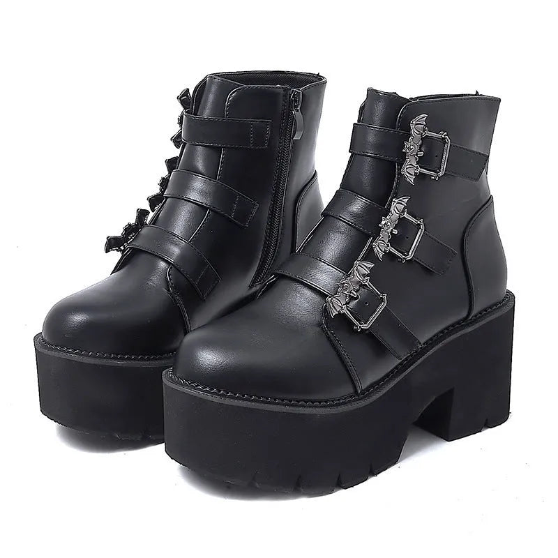 Black women's punk gothic short ankle boots with a bat buckle and side zip.