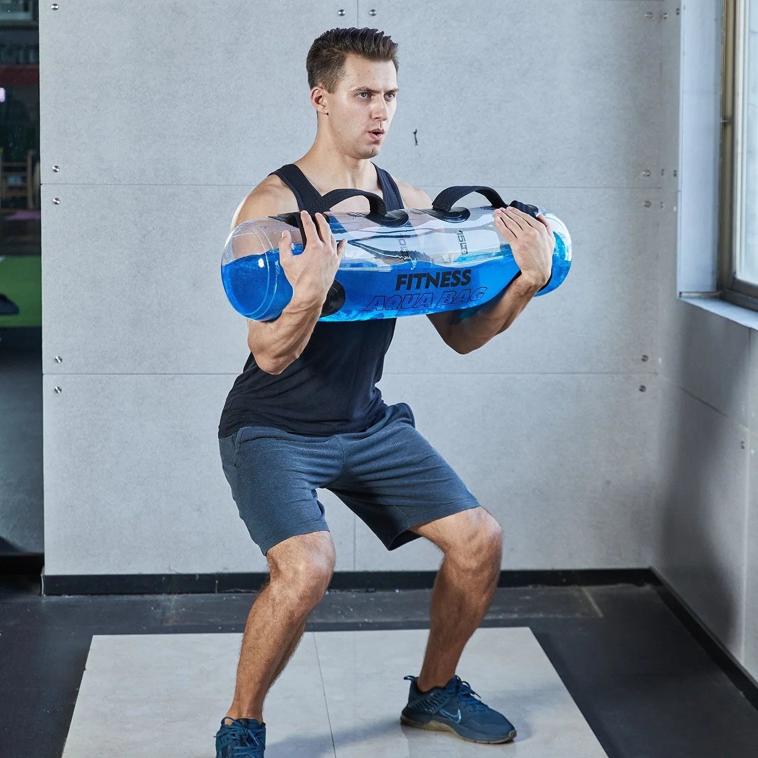 Transparent PVC inflatable dumbbell bag filled with water for adjustable weight strength training.
