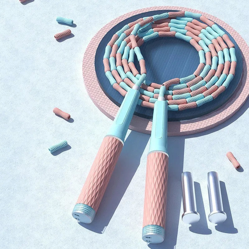 Children's bamboo bead skipping rope in blue, green, pink, or purple on a 2.8m cord.