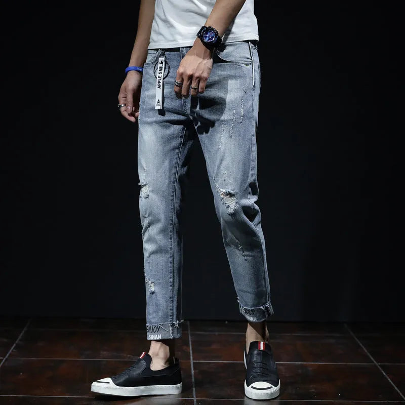 Light blue youth ripped stretch denim cropped skinny jeans mid-waist zip fly