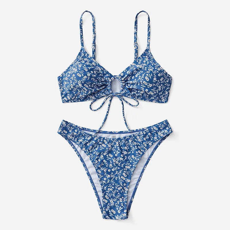 Blue polyester three-piece swimsuit set comprising a rash vest and matching shorts.