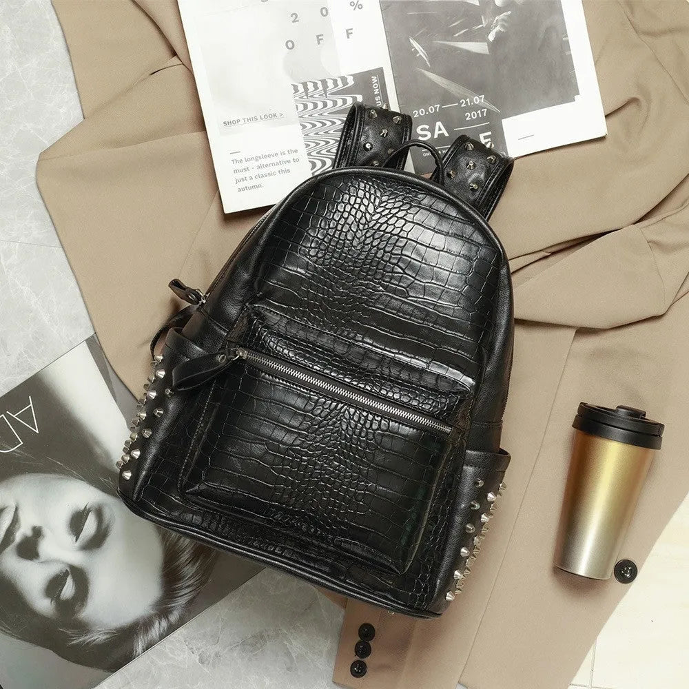Black waterproof computer schoolbag with oil wax leather features and rivet detailing
