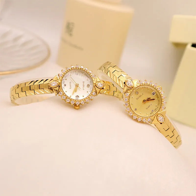 Vintage quartz bracelet watch with diamond-embossed detailing and golden face