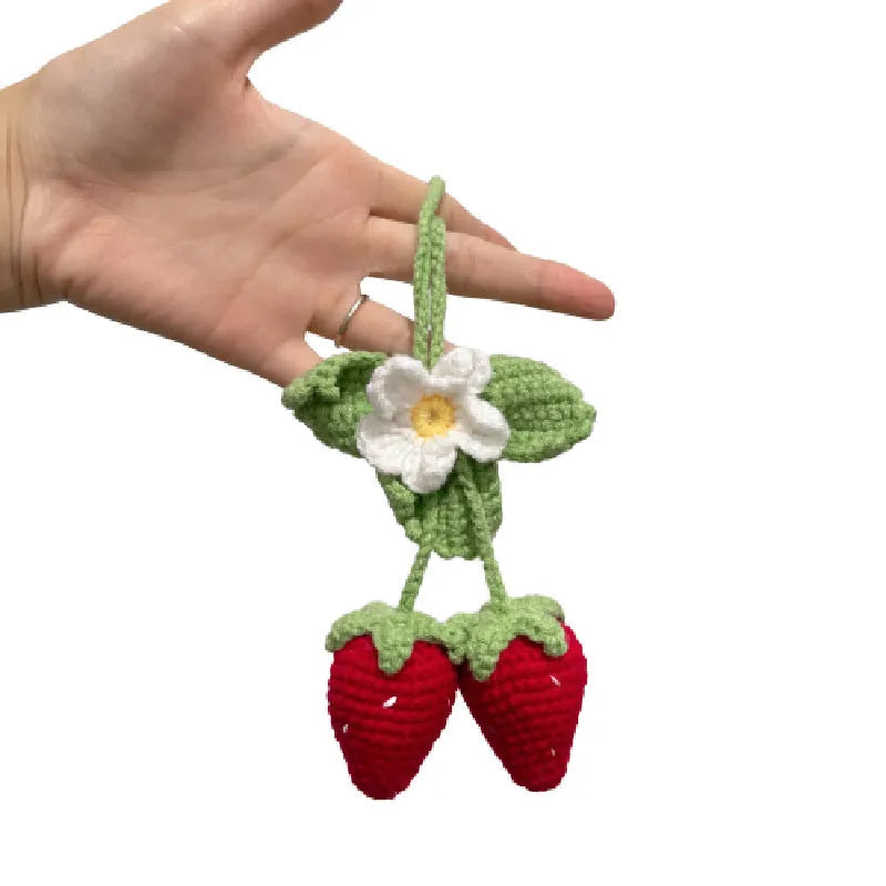 Handmade strawberry-shaped car pendant knitted from cotton and hemp wool.