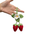 Handmade strawberry-shaped car pendant knitted from cotton and hemp wool.