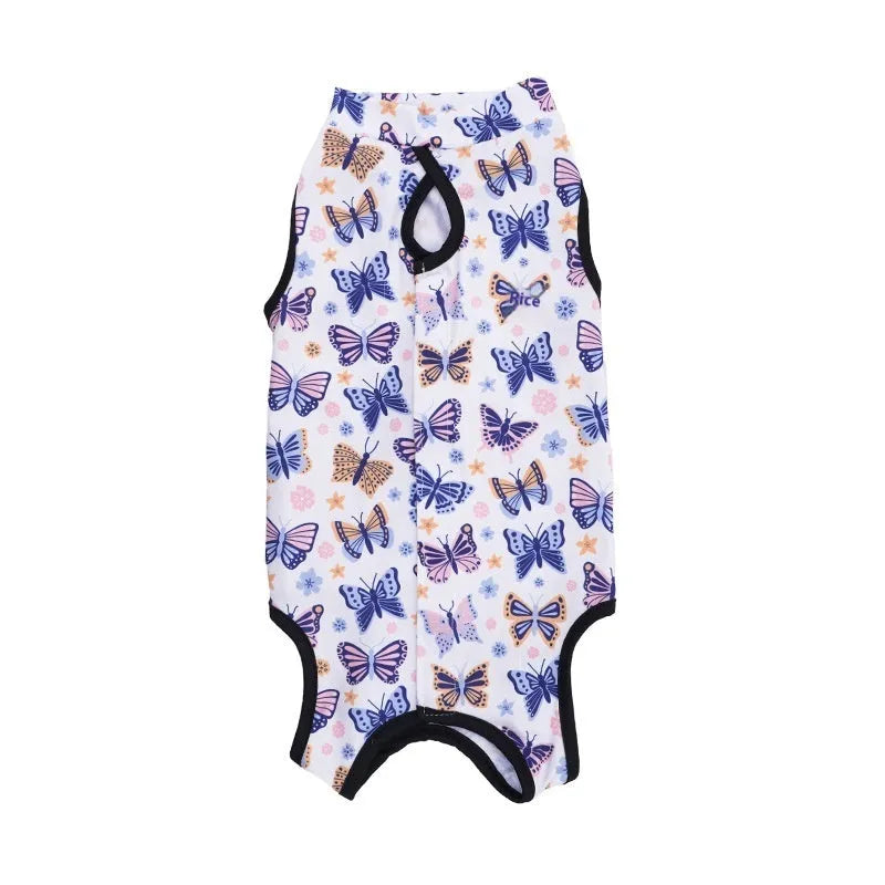 A cat wearing a printed polyester recovery suit with Velcro fastening on its side.