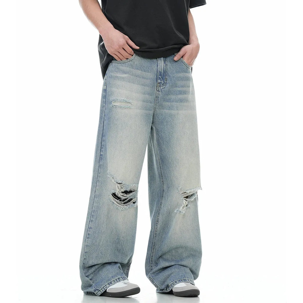 Blue straight-leg men's jeans with retro ripped detailing and zipper fly
