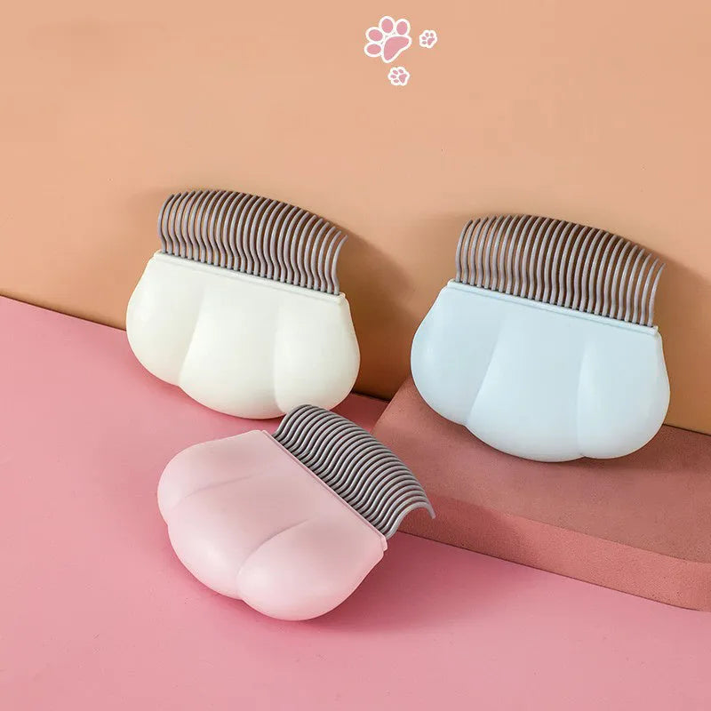 Paw Soft deshedding brush in blue, pink or white, showing 4-blade dematting head on 9cm square tool.