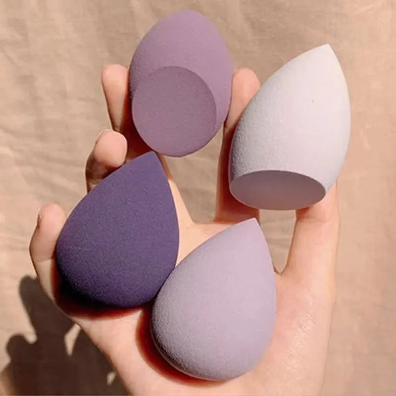 Set of 10 nude, pink and rose red hydrophilic non-latex makeup sponges in bevel drop and peach heart shapes.