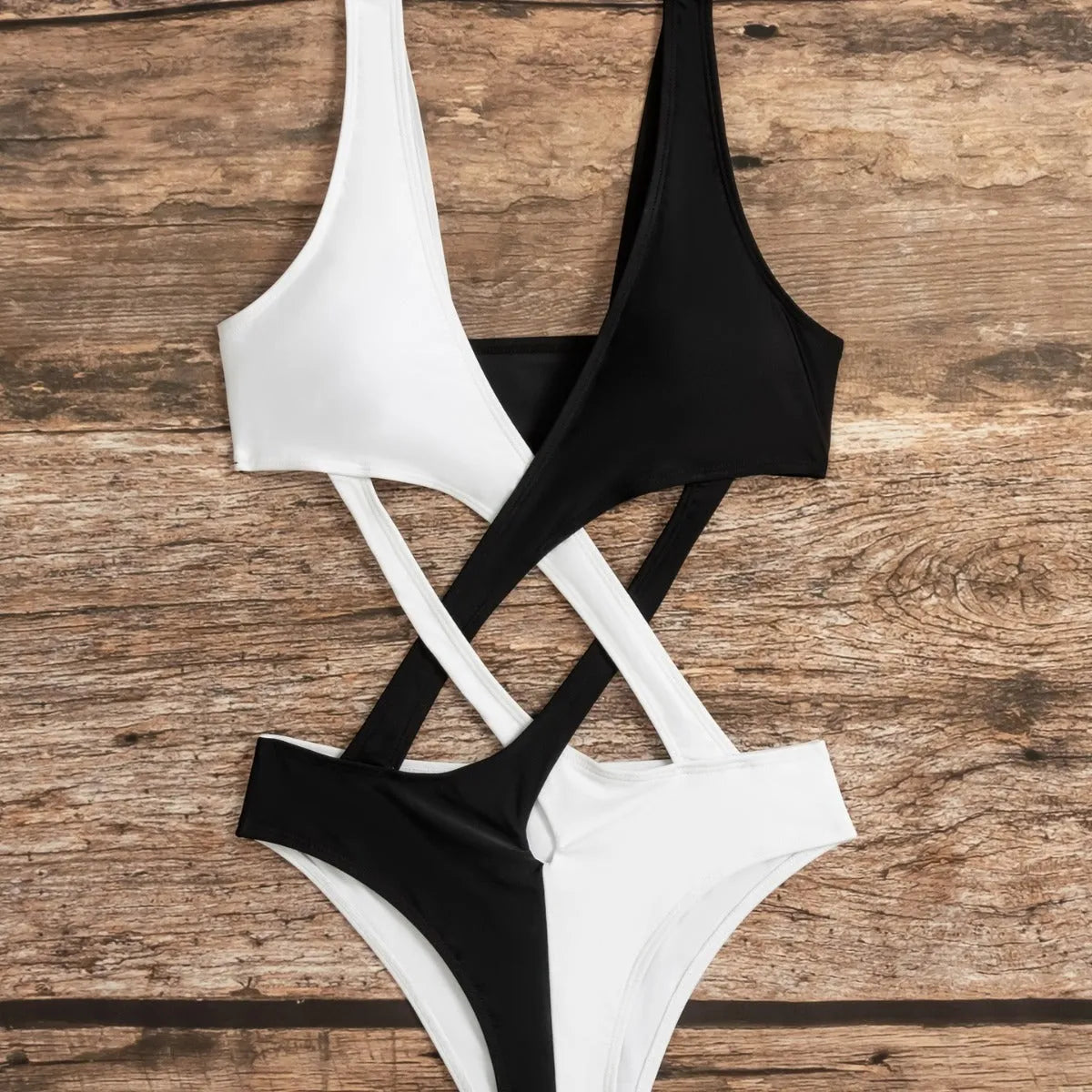 White women's one-piece swimsuit with colour-blocking and hollow-out design details.