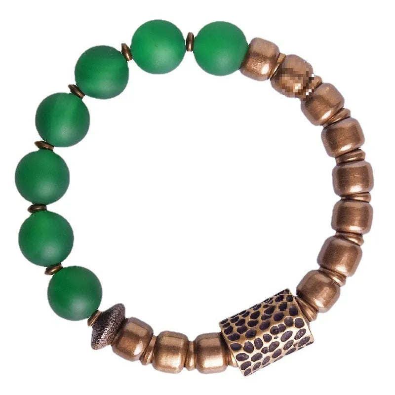 Retro ethnic style couples bracelet with natural green agate beads shown on a wrist.