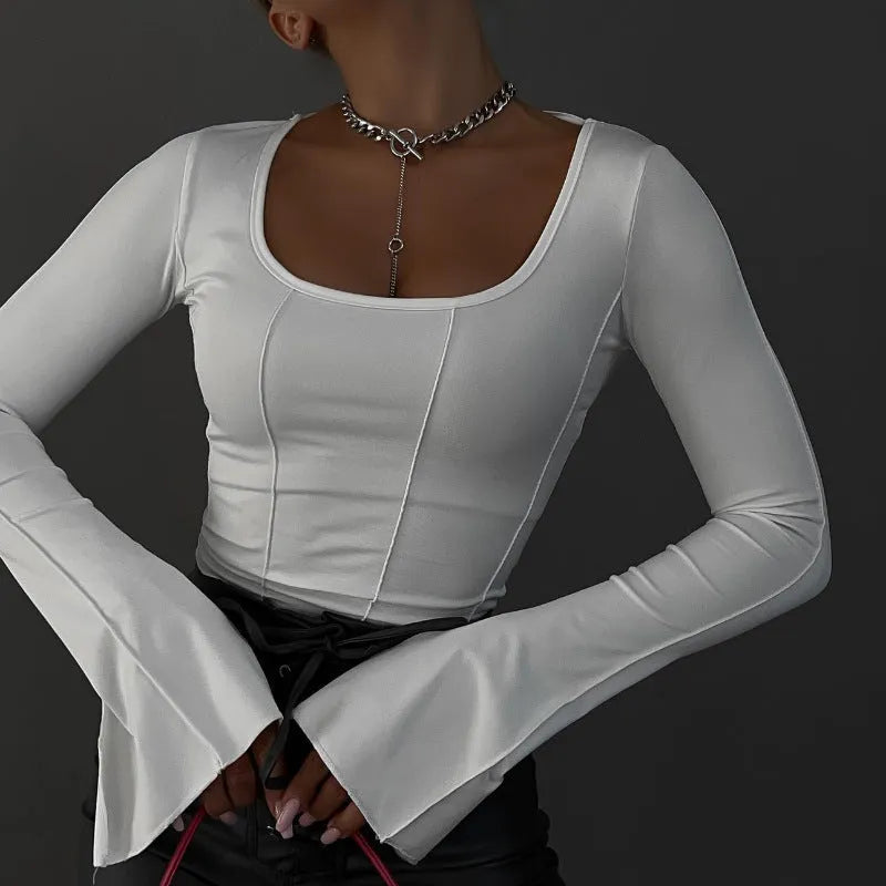 White square-neck fitted long-sleeve knit top with flared sleeves and 3D pattern on a model