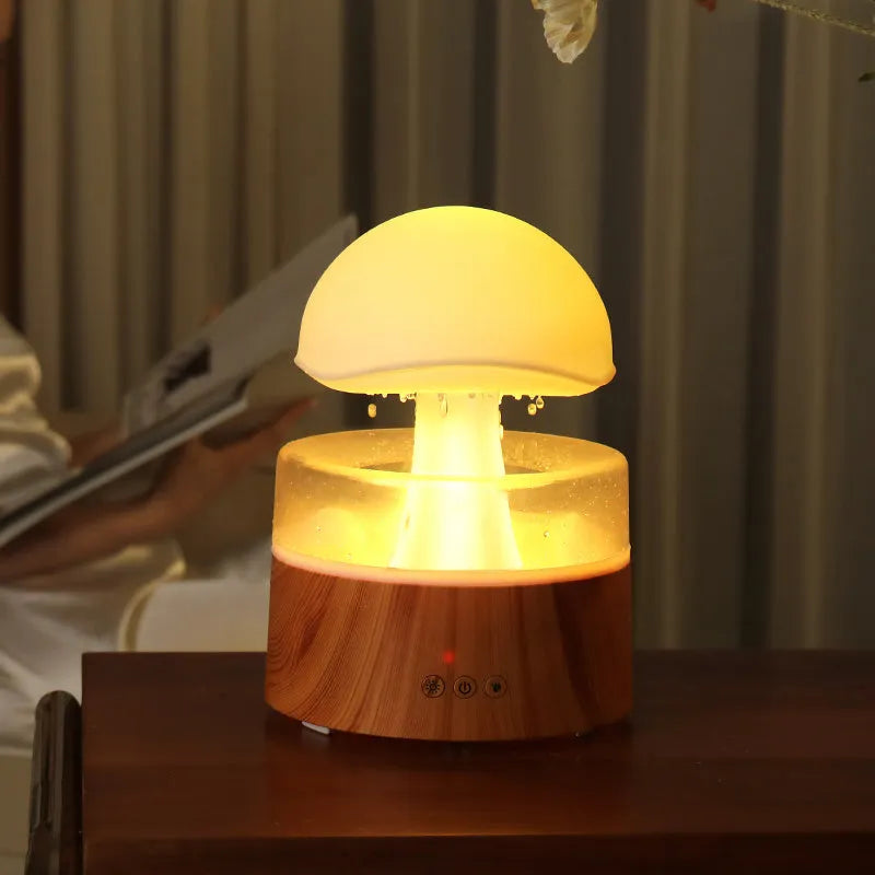 White cloud-shaped humidifier with falling raindrops and colour-changing night light