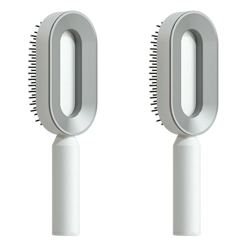 Self-cleaning air cushion hair brush in white, black gold, or black purple with ergonomic handle