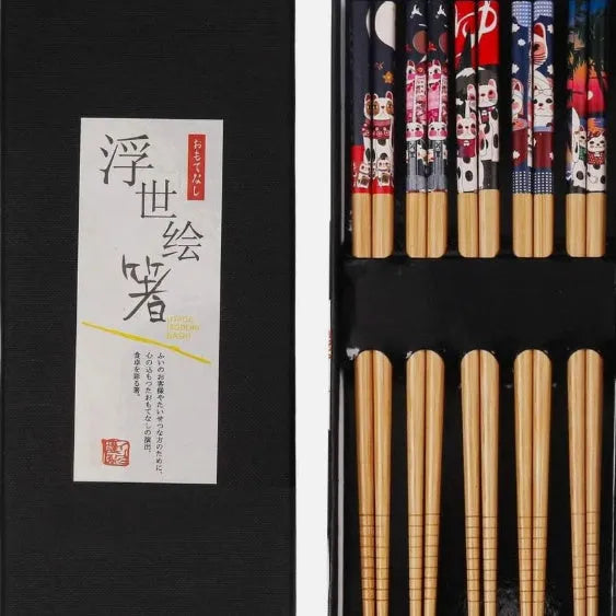 Set of five pairs of bamboo chopsticks with colourful Japanese lucky cat and elegant blue patterns.
