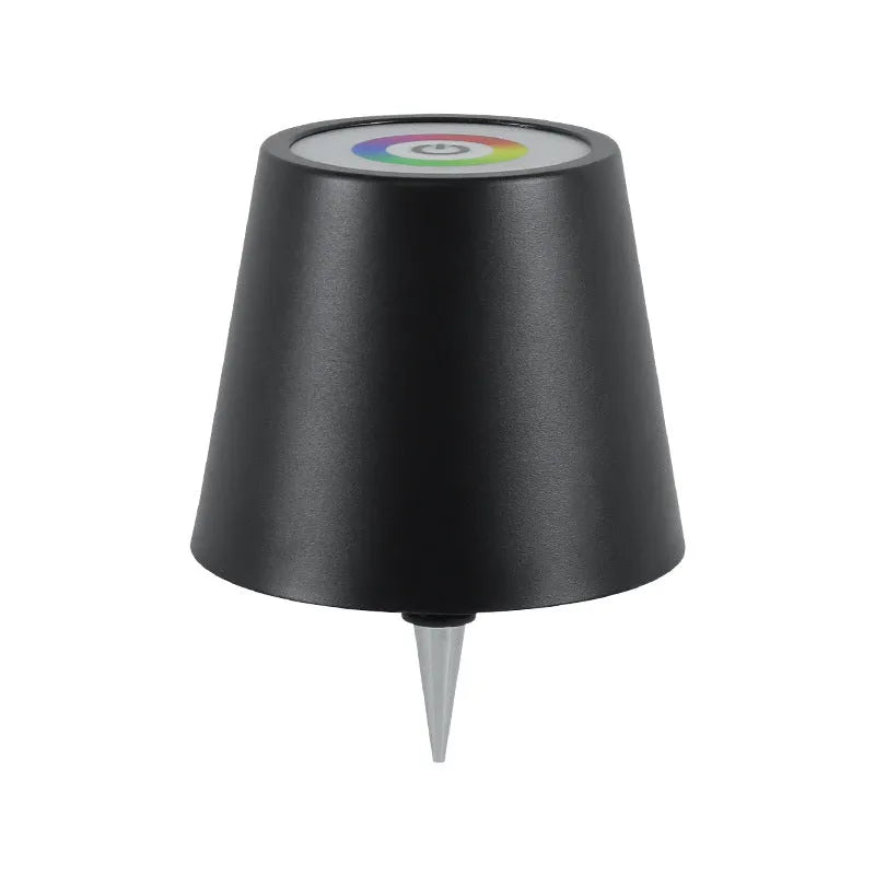 Plug-in wine bottle lamp with RGB tricolour dimming in wrought iron black finish on a table