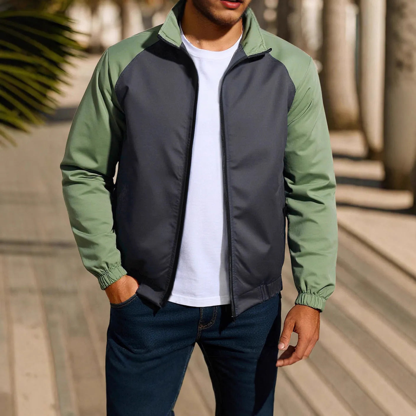 Men's green casual coat jacket with a stand collar and raglan sleeves on a hanger