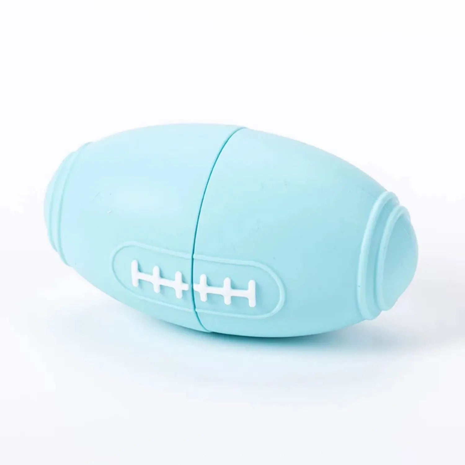 Blue silicone rugby ball dog chew toy with food dispensing holes
