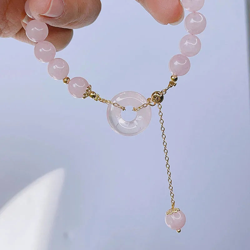Pink crystal women's bracelet with peace buckle design and adjustable safety buckle closure