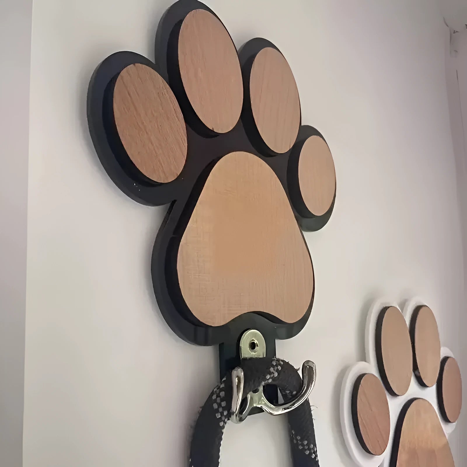Wooden wall hook with paw print design in black or white for household organisation