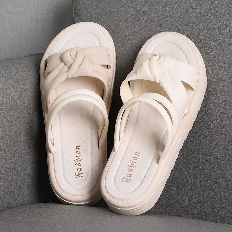 Women's black and white PVC sandals with a soft back, two-way strap design, and a non-slip sole.