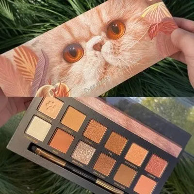 Explorer twelve-colour animal eye shadow plate showing twelve pressed powder shades in compact palette