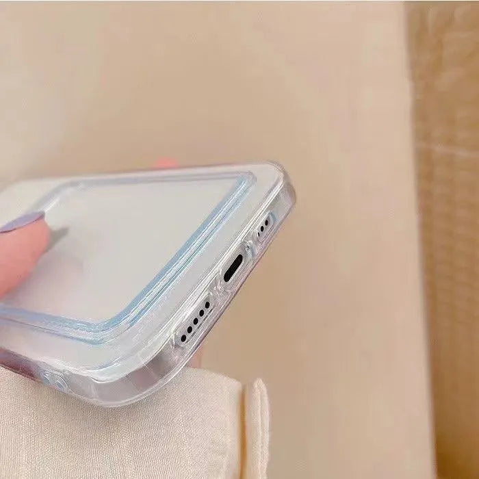 Transparent phone case with card slot for Apple iPhone on a table.