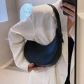 Retro dumpling-shaped women's shoulder bag in PU leather with a front pocket.