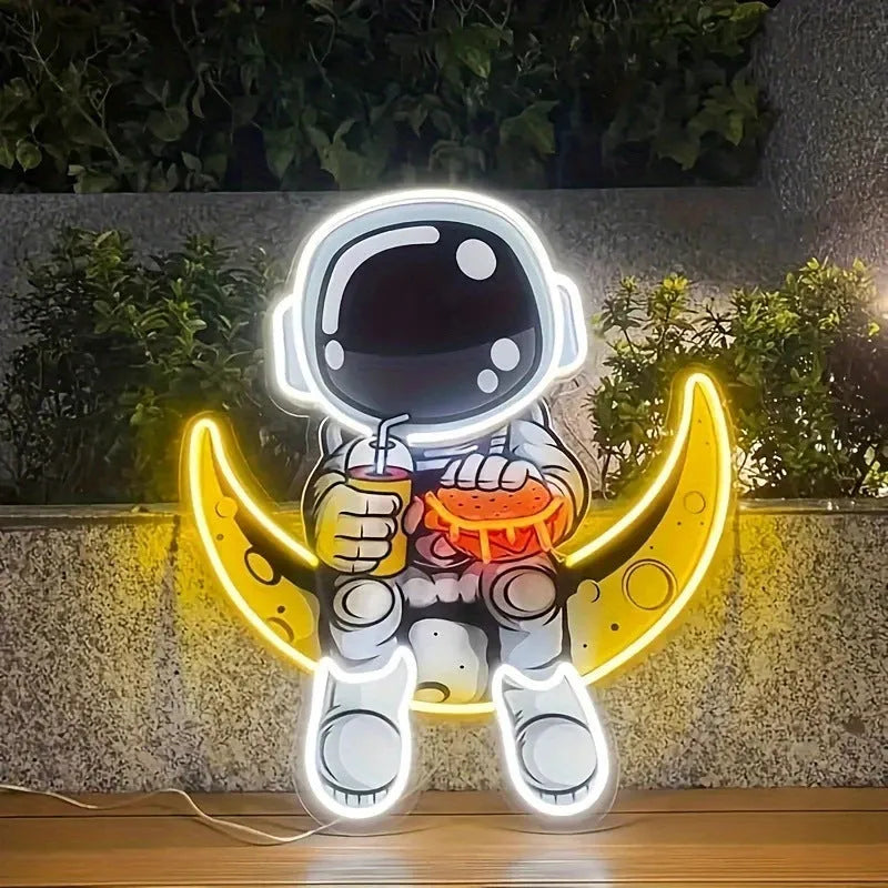 Blue Astronaut shaped LED neon light mounted on a wall, powered by USB.