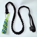 Green cotton thread dog tug rope toy with a ball style end for interactive bite and pull games.