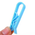 White PP plastic non-slip clip for fixing a bin liner to the side of a kitchen rubbish bin.