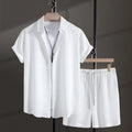 Men's black cotton blend short sleeve shirt and matching shorts laid flat as a summer set.