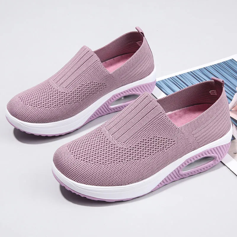Women's mesh running shoes with air cushion midsole in beige colour showing round toe design