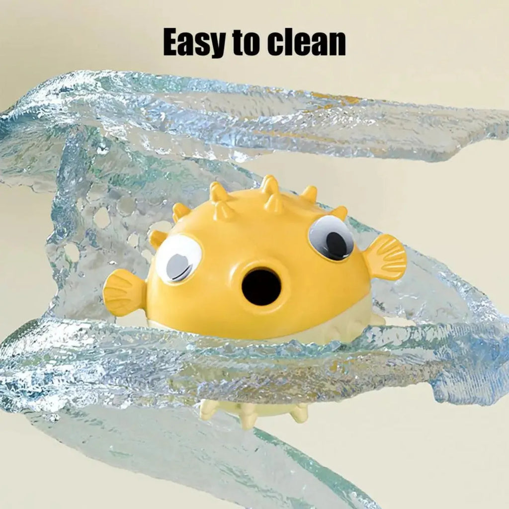 Yellow vinyl fish-shaped squeaky dog chew toy on a plain background
