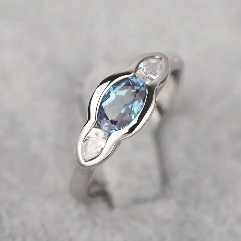 Women's geometric ellipse copper ring with inlaid zircon stones in white gold colour