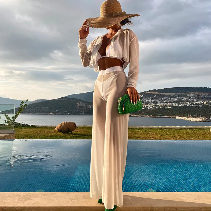 White women's swimwear four-piece set with high-waisted bottoms and backless top on a mannequin