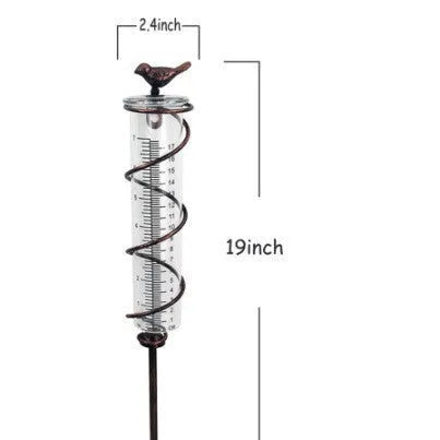 Cast iron garden rain gauge with hummingbird design and glass measurement tube showing 0-800ml capacity