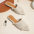 Women's denim flat slipper with tassel detail, leather lining, and a solid colour option.