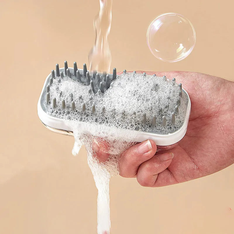 Grey and pink silicone bath massage brush for washing dogs and cats.
