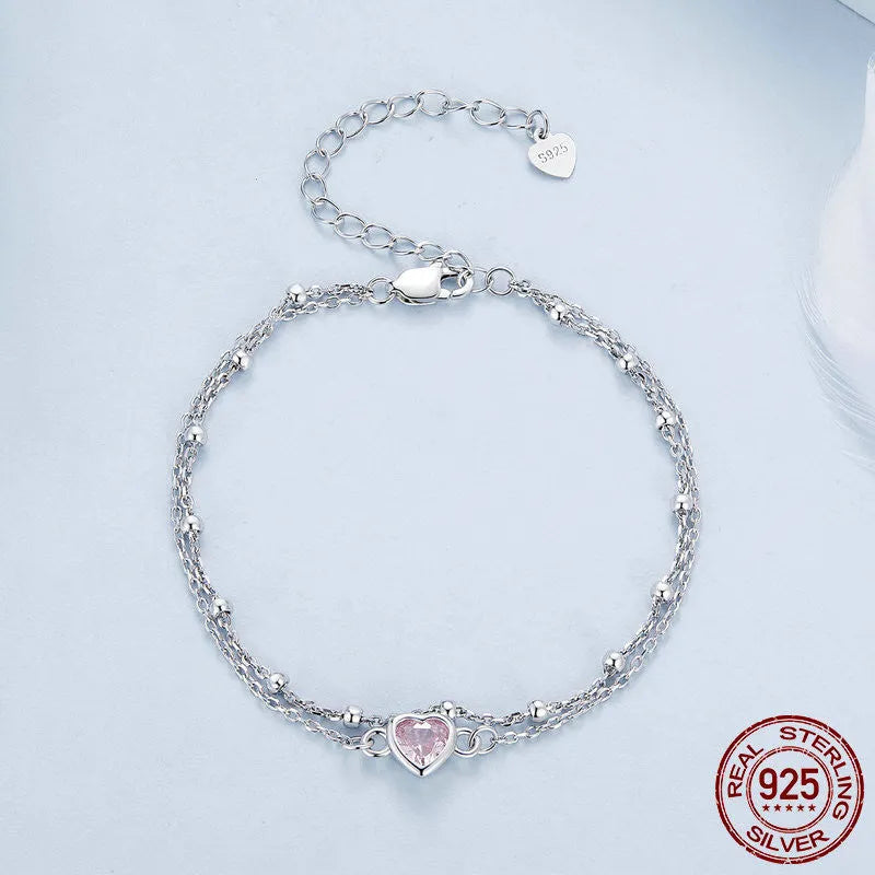 Women's sweet style 925 silver bracelet with small heart-shaped pendant on an adjustable chain.