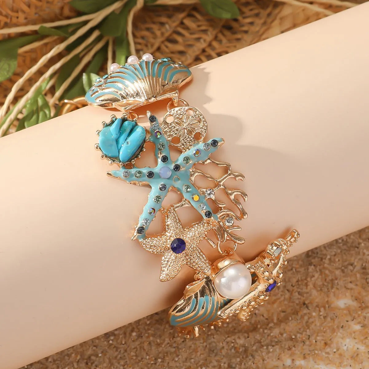 Alloy boat anchor and starfish bracelet for women in turquoise, red, or blue.