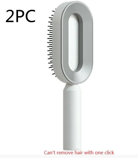Self-cleaning air cushion hair brush in white, black gold, or black purple with ergonomic handle