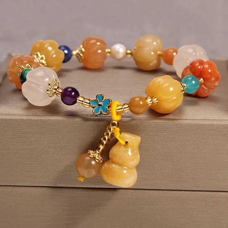 Yellow agate stone bracelet for women with gold silk threading on a wrist
