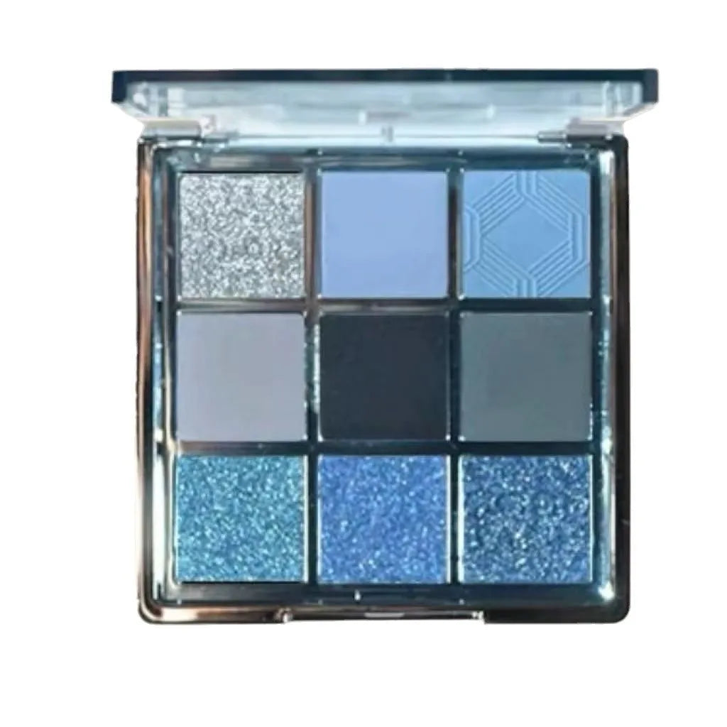 MUGELEEN nine-colour eye shadow palette open showing blue smoked and earth tone shades with matte and shimmer finishes.