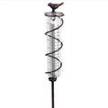 Cast iron garden rain gauge with hummingbird design and glass measurement tube showing 0-800ml capacity