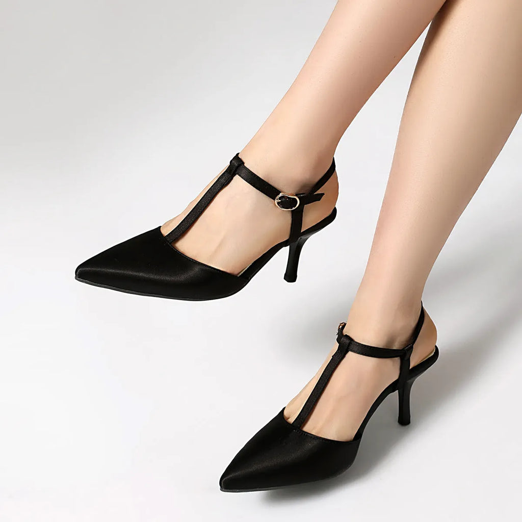 Pointed T-strap high heels in top grain leather, available in black and brown