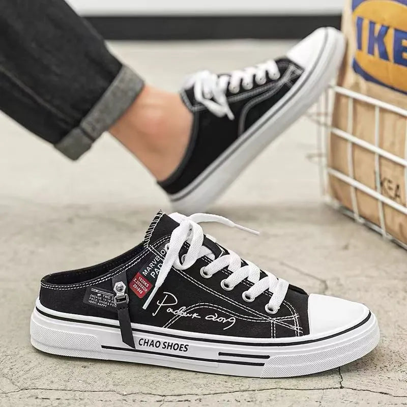 Men's canvas slip-on shoes in black with round toe and PVC sole