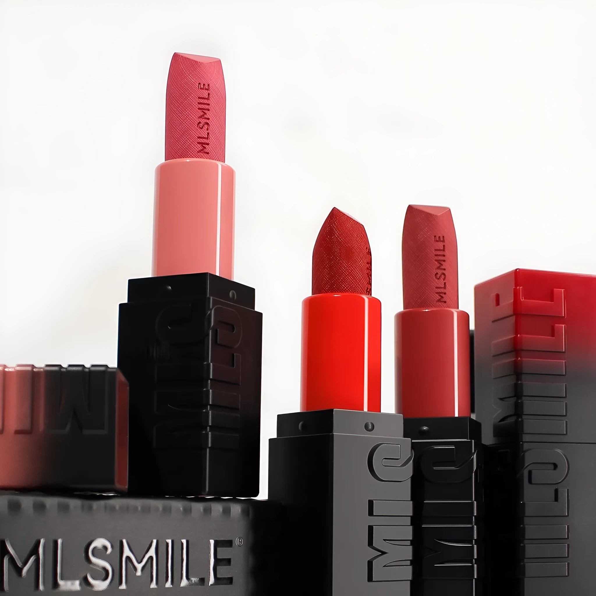 MLSMILE embossed lipstick set of three tubes in a box measuring 7.7cm by 6.8cm.