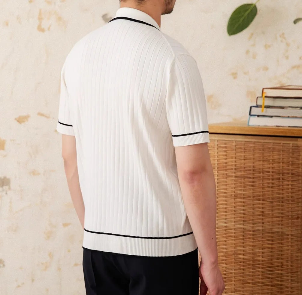 A man's slim-fit short-sleeved polo shirt with a lapel collar, shown in black and white.