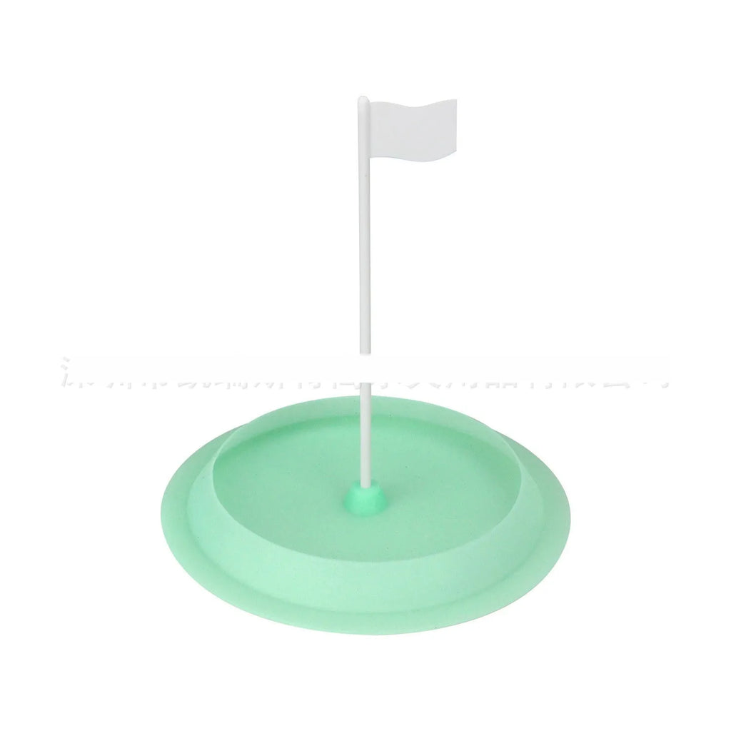 Green silicone putting disc for indoor golf practice measuring 16cm diameter